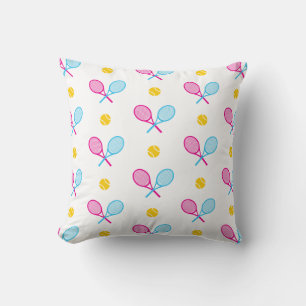 Coussin Rackets de tennis croisés rose et bleu portant le
