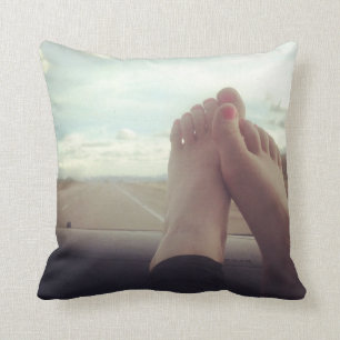 Coussin relaxer les pieds sur le tableau de bord