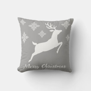 Coussin Renne courant blanc sur fond gris avec flocons de