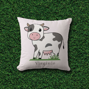 Coussin rose avec une jolie vache