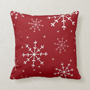 Coussin rouge et blanc de flocon de neige