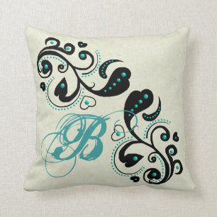 Coussin Rouleau et turquoise noirs de coeur perlant des