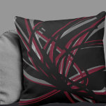 Coussin Rubans Abstraits artistiques noirs et bordeaux<br><div class="desc">L'oreiller à jetons noir et bordeaux présente une composition artistique abstraite de ruban aux tons bordeaux et vin aux accents blancs sur un arrière - plan noir. Cette composition abstraite est construite sur des combinaisons de rubans répétés, qui sont superposés et entrelacés pour former un motif abstrait complexe et complexe....</div>