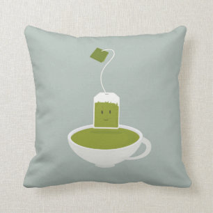 Coussin Sac à thé vert souriant avec tasse de thé