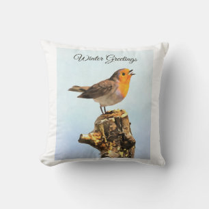 Coussin Salutations d'hiver. Rouge-gorge chantant