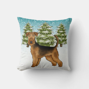 Coussin Tervueren Airedale dans une forêt enneigée en hive