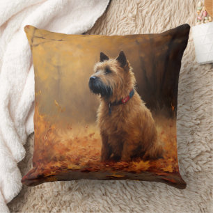 Coussin Tervueren dans les feuilles d'automne