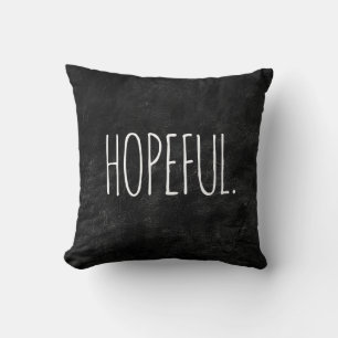 Coussin Texte HOPEUL sur cuir noir