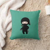 Coussin Tiny Ninja tenant l'étoile à projeter sur le vert (Couverture)