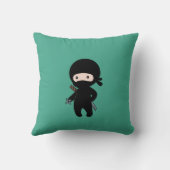 Coussin Tiny Ninja tenant l'étoile à projeter sur le vert (Verso)