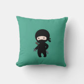 Coussin Tiny Ninja tenant l'étoile à projeter sur le vert (Recto)