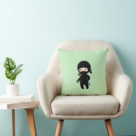 Coussin Tiny Ninja tenant l'étoile à projeter sur le vert (Chaise)