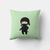 Coussin Tiny Ninja tenant l'étoile à projeter sur le vert (Verso)