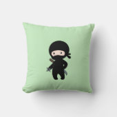 Coussin Tiny Ninja tenant l'étoile à projeter sur le vert (Recto)