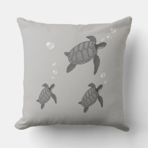 Coussin Tortues de mer grises nageant sur fond de couleur