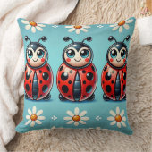 Coussin Trois coccinelles colorées sur fond bleu (Couverture)