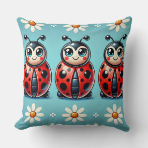 Coussin Trois coccinelles colorées sur fond bleu