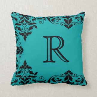 Coussin turquoise et noir de damassé de monogramme