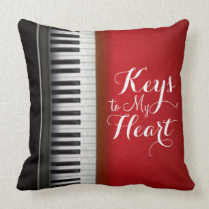 Coussin Typographie des touches de piano blanc rouge noir
