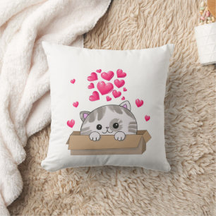 Coussin Un chaton mignon qui regarde hors d'une boîte