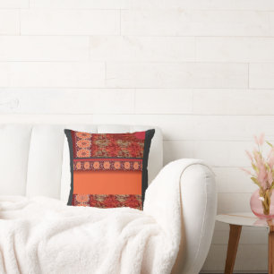 Coussin un design d'un motif rouge et or