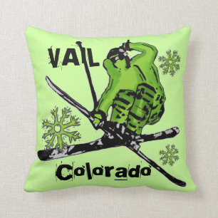 Coussin vert au néon de skieur de thème de Vail