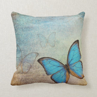 Coussin vintage de papillon bleu