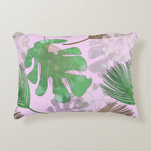 Coussins Décoratifs Feuilles tropicales sur fond rose pâle.