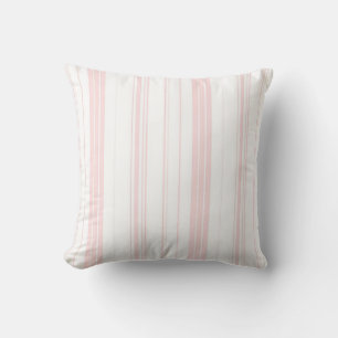 Coussins et coussins rayés de rose et blancs -