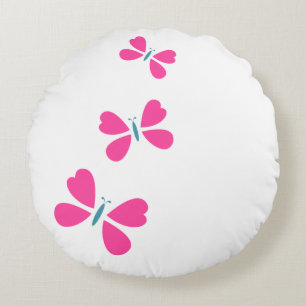 Coussins Ronds Le papillon rose vole
