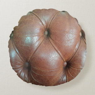 Coussins Ronds Lumière sur la surface du canapé en cuir marron, t