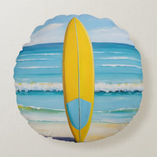 Coussins Ronds Planche de surf bleue et jaune sur la plage