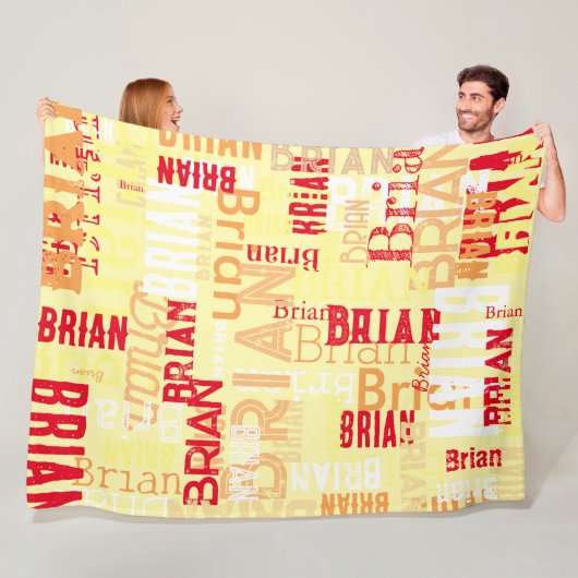 Couverture en polaire avec un motif de nom. (En situation)