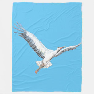 Couverture Polaire cigogne blanche volant sur l'arrière - plan bleu