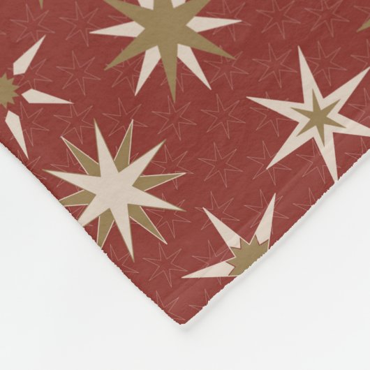 Couverture Polaire Etoiles de Noël Gold Geo - sur motif rouge. (Coin)
