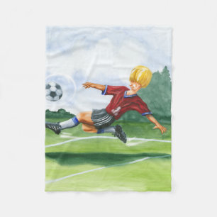 Couverture Polaire Footballeur donnant un coup de pied une boule par