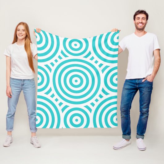 Couverture Polaire Motif circulaire imbriqué Turquoise et Blanc (En situation)