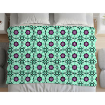 Motif mandala géométrique vert menthe et violet