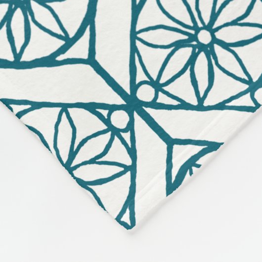 Couverture Polaire Turquoise sur Motif ethnique blanc, Fleurs, Chevro (Coin)