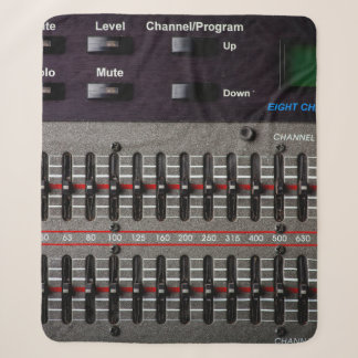 Couverture Sherpa Buttons on a sound mixer in a recording studio.