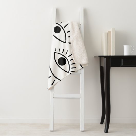 Couverture Sherpa Doodle eye, motif créatif sans couture. (En situation)