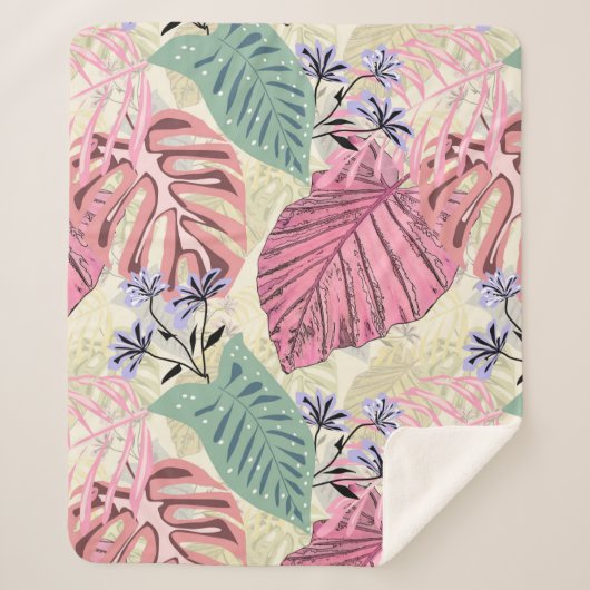 Couverture Sherpa Feuilles tropicaux roses et verts, fleurs bleues. (Devant)