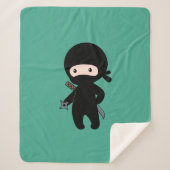 Couverture Sherpa Tiny Ninja tenant l'étoile au lancer sur le vert f (Devant)