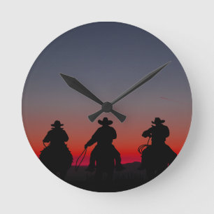 cowboy bij zonsondergang ronde klok