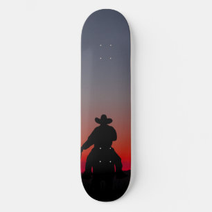 cowboy bij zonsondergang skateboard