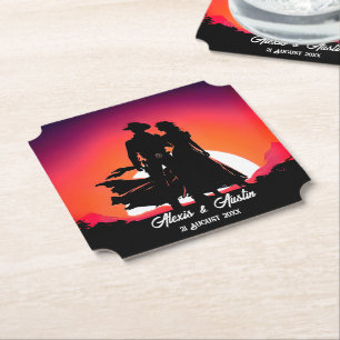 Cowboy en cowgirl bij zonsondergang kartonnen onderzetters