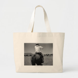Cowboy op een paard met twee merken. grote tote bag