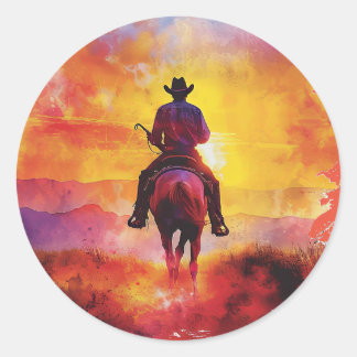 Cowboy op zonsondergang rijden sticker. ronde sticker