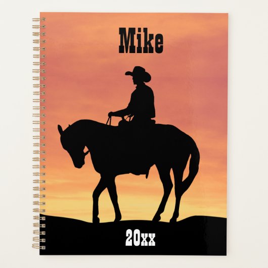 Cowboy te paard bij zonsondergang planner (Voorkant)