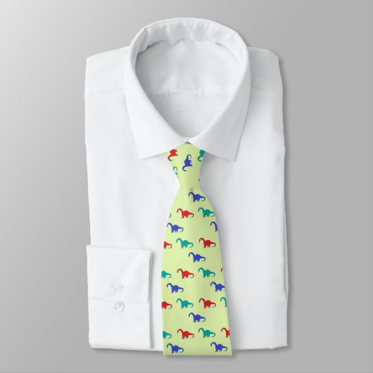 Cravate Dinosaures colorés motif sur vert (Attaché)